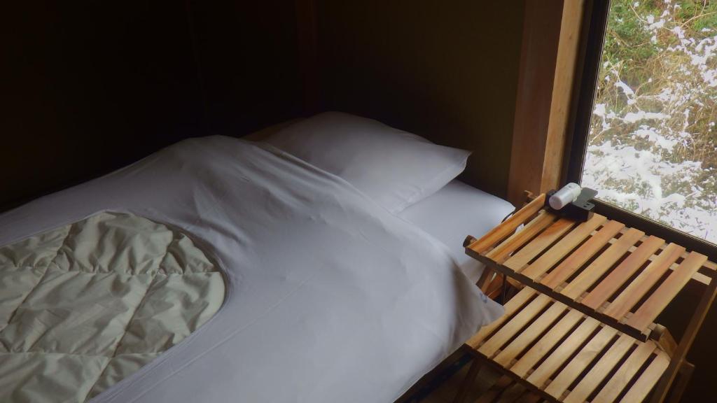 Cosmos Guesthouse Iya Valleyにあるベッド