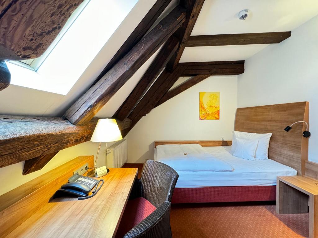 Postel nebo postele na pokoji v ubytování Hotel Haimerlhof