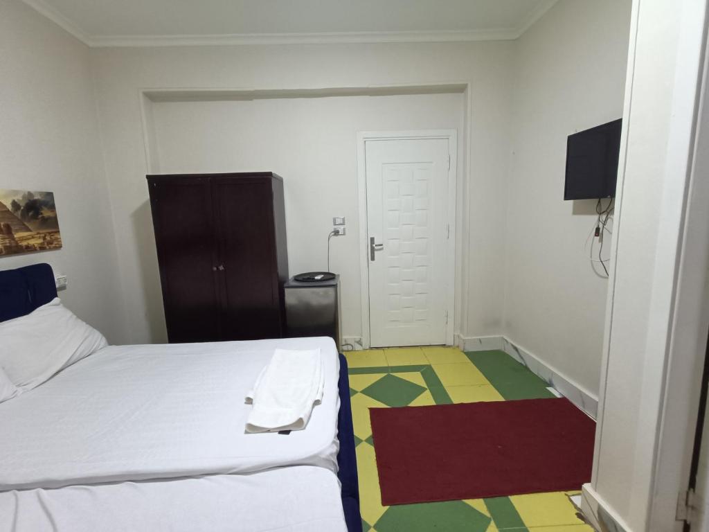 Postel nebo postele na pokoji v ubytování New Pyramids hostel