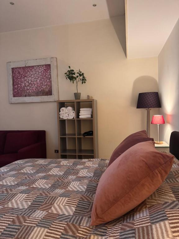 A bed or beds in a room at Roma Da Noi Suite