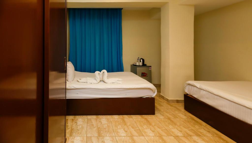 Postel nebo postele na pokoji v ubytování Giza Pyramids Inn