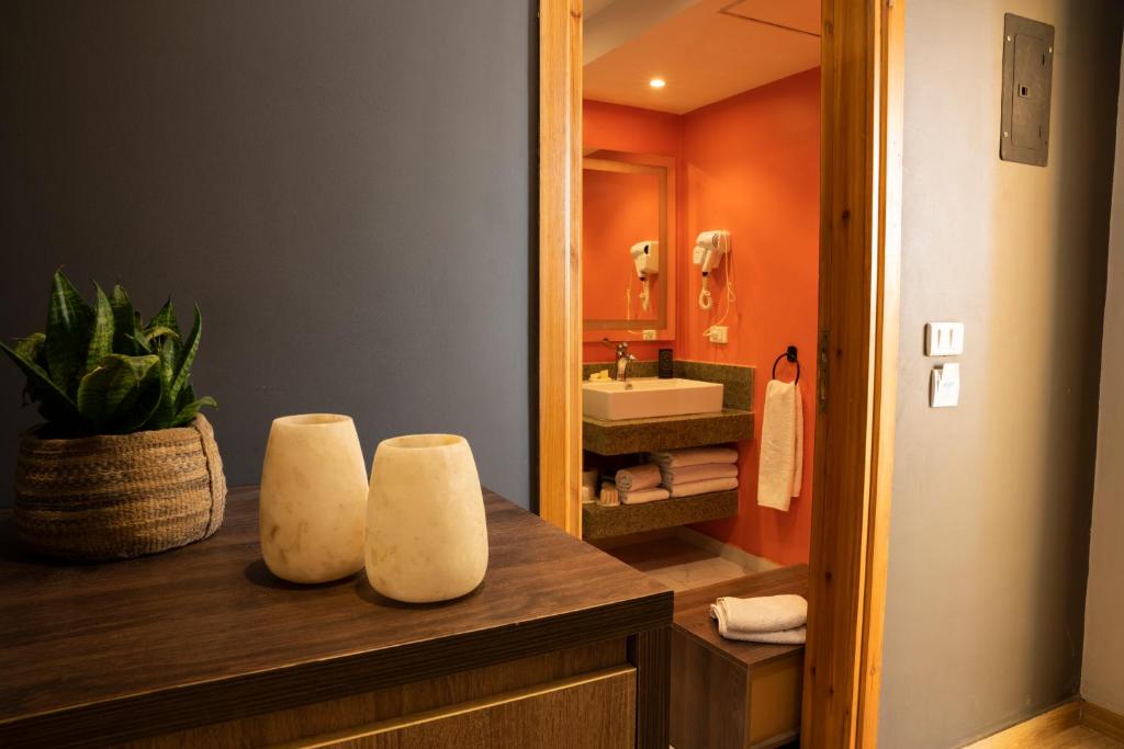 a bathroom with a sink and a mirror at Al-Dora Resort Hurghada in Hurghada