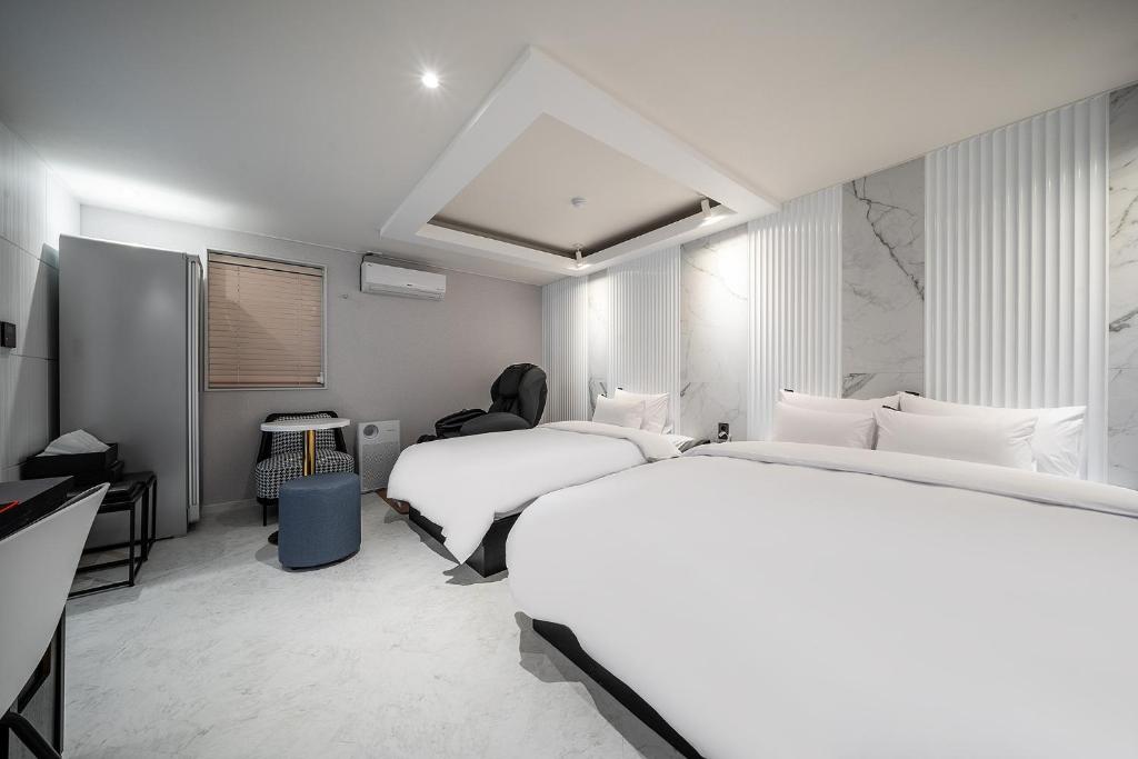 Postel nebo postele na pokoji v ubytování Story 9 Hotel