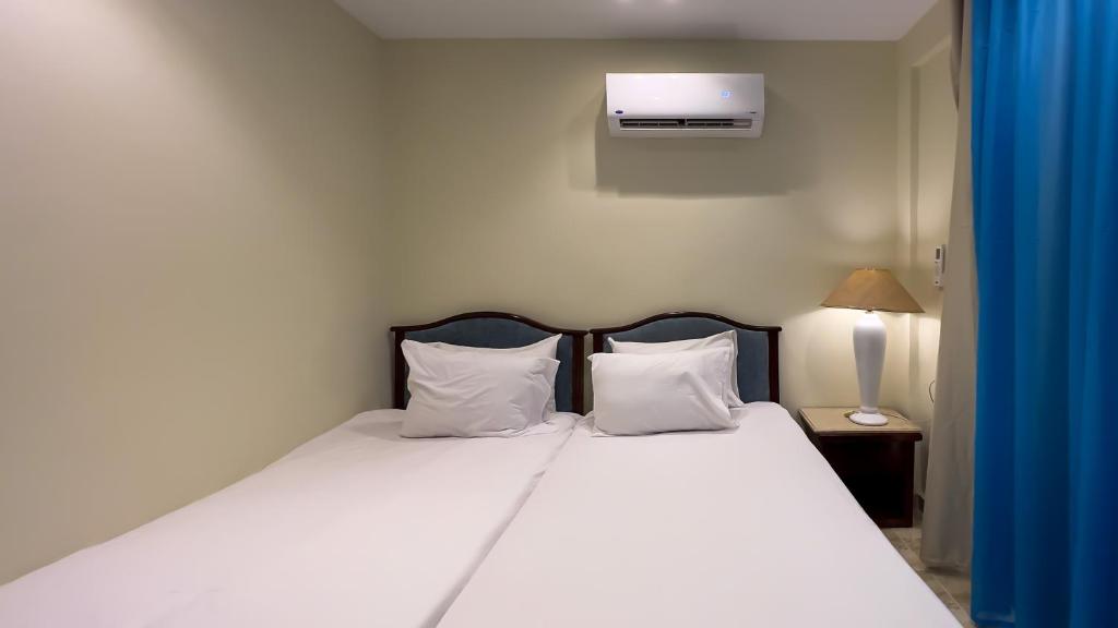 Postel nebo postele na pokoji v ubytování Giza Pyramids Inn