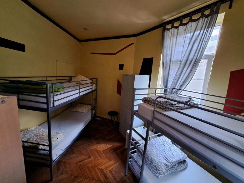 Postel nebo postele na pokoji v ubytování FunHouse
