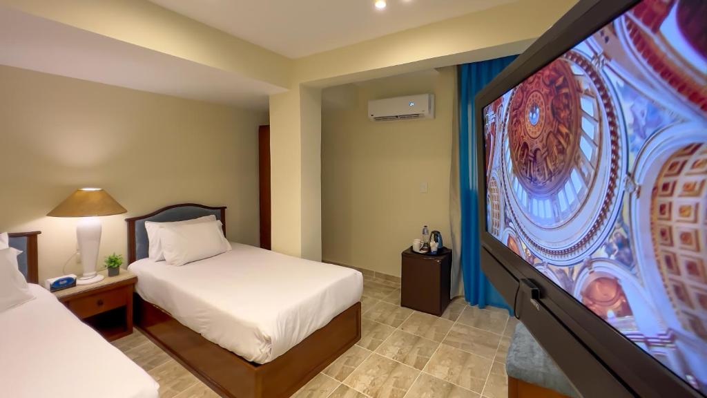 Postel nebo postele na pokoji v ubytování Giza Pyramids Inn