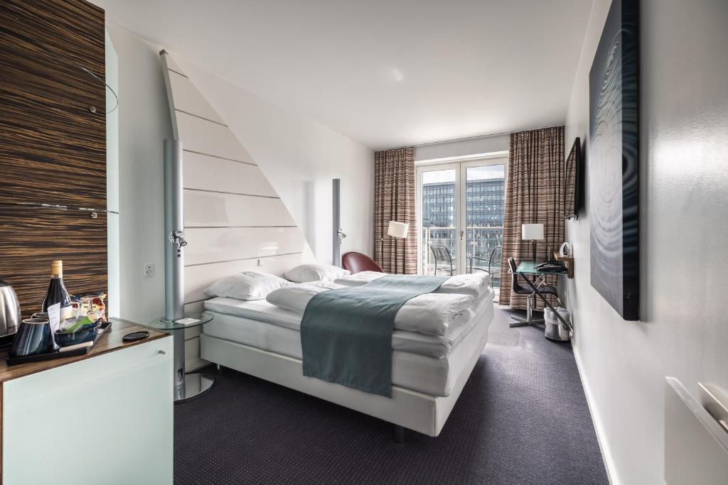 Postel nebo postele na pokoji v ubytování Copenhagen Island Hotel