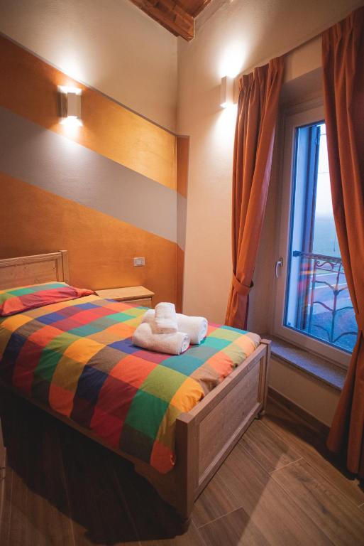 Postel nebo postele na pokoji v ubytování Agriturismo Corte Alussi