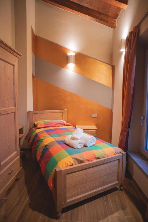 Postel nebo postele na pokoji v ubytování Agriturismo Corte Alussi