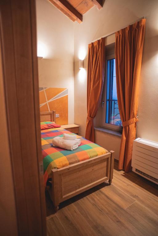 Postel nebo postele na pokoji v ubytování Agriturismo Corte Alussi