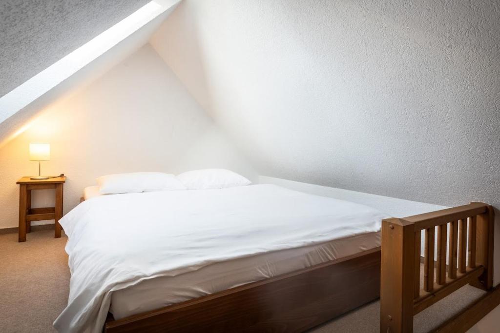 Postel nebo postele na pokoji v ubytování Apartmánový dom Vila Maroš