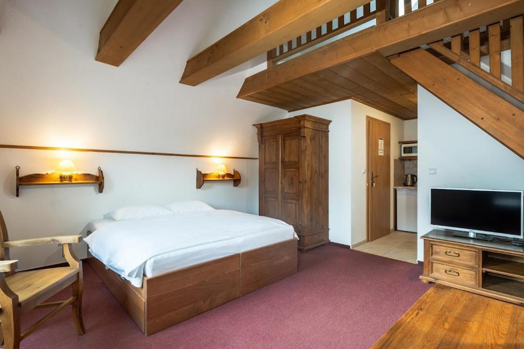 Postel nebo postele na pokoji v ubytování Apartmánový dom Vila Maroš