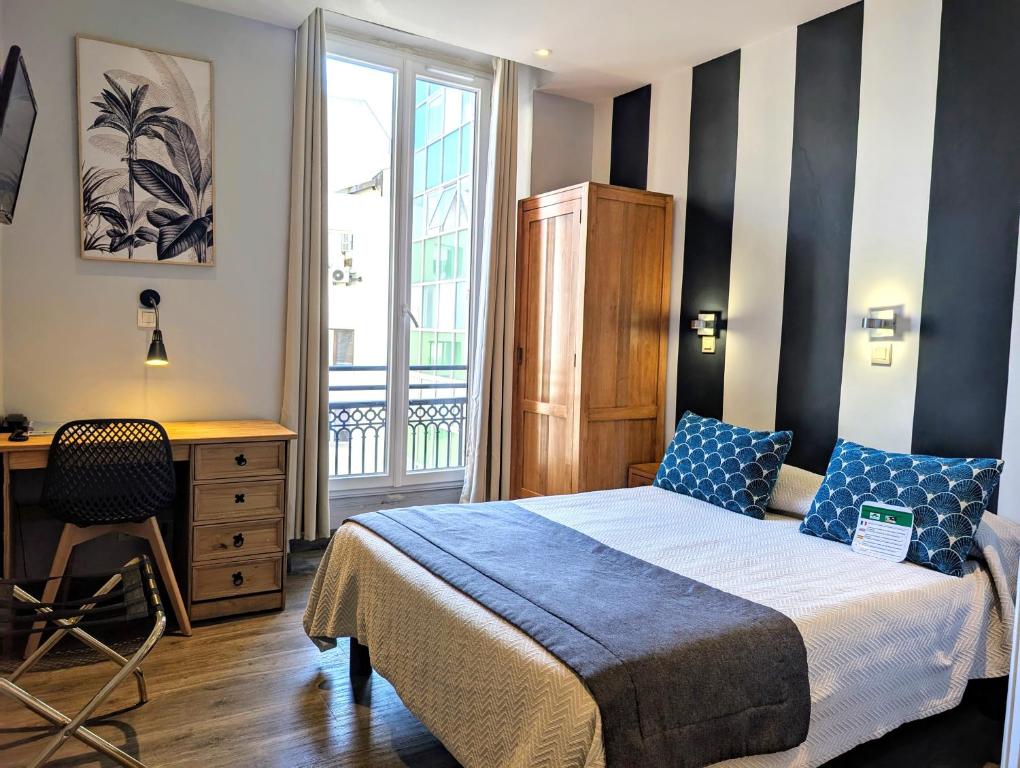 Postel nebo postele na pokoji v ubytování H33 Hôtel