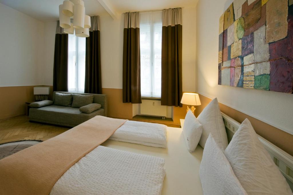Postel nebo postele na pokoji v ubytování Monello Apartments - Charmanter Altbau