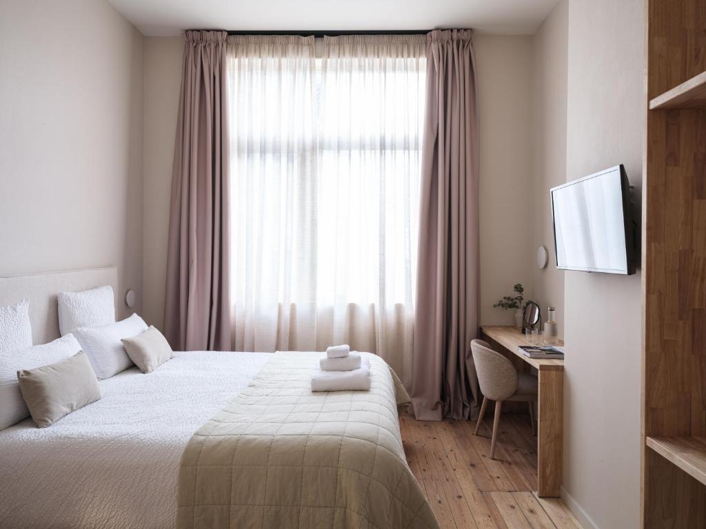 Postel nebo postele na pokoji v ubytování Lits de Lo - Boutique Rooms