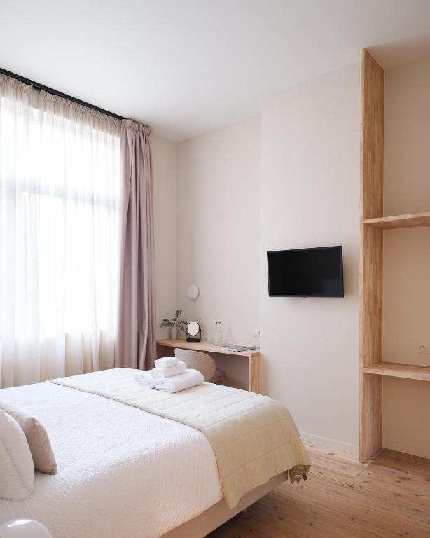 TV a/nebo společenská místnost v ubytování Lits de Lo - Boutique Rooms