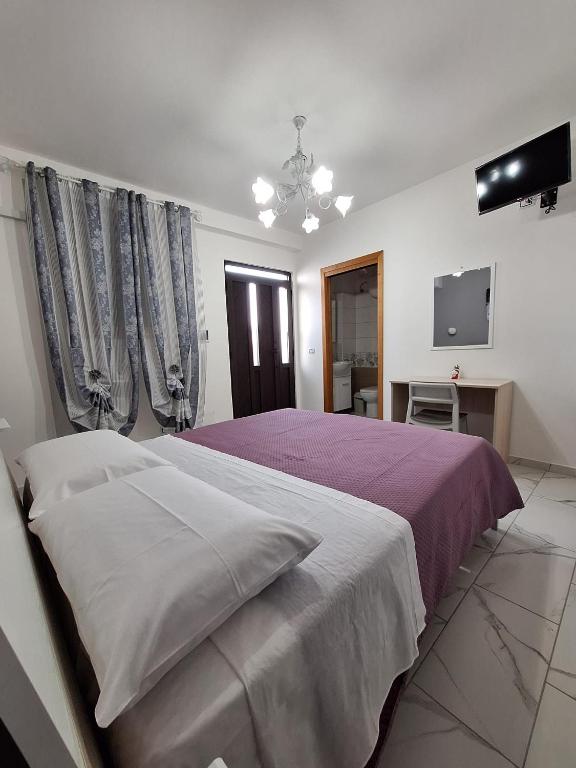 Postel nebo postele na pokoji v ubytování Casa Vacanze Belvedere