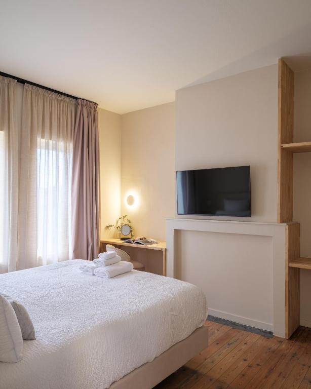 Postel nebo postele na pokoji v ubytování Lits de Lo - Boutique Rooms