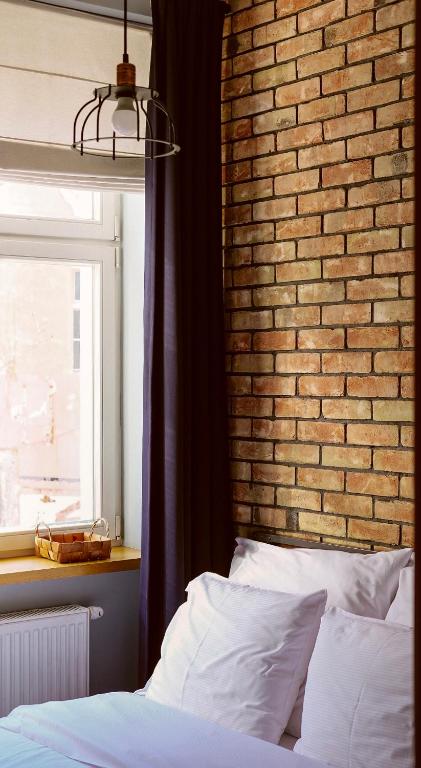 Posteľ alebo postele v izbe v ubytovaní Too-Good Apartments