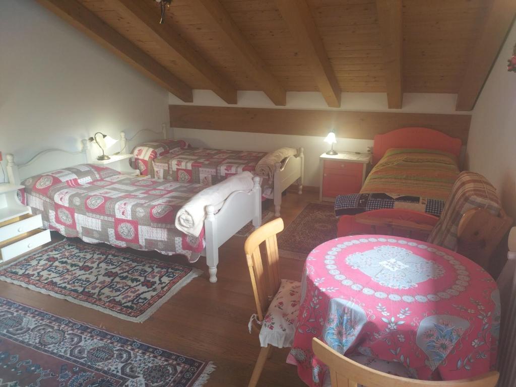 Postel nebo postele na pokoji v ubytování B&B Dolomiti