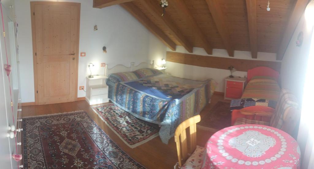Postel nebo postele na pokoji v ubytování B&B Dolomiti