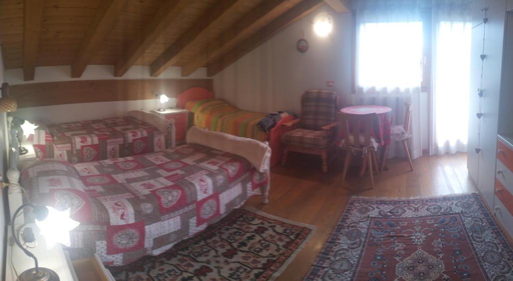 Postel nebo postele na pokoji v ubytování B&B Dolomiti