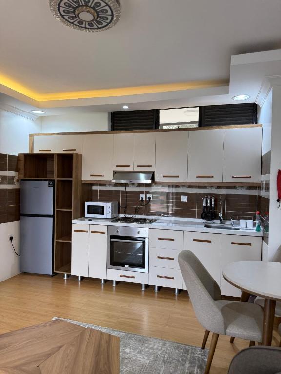 Kuchyň nebo kuchyňský kout v ubytování Cascadia Apartments Kigali