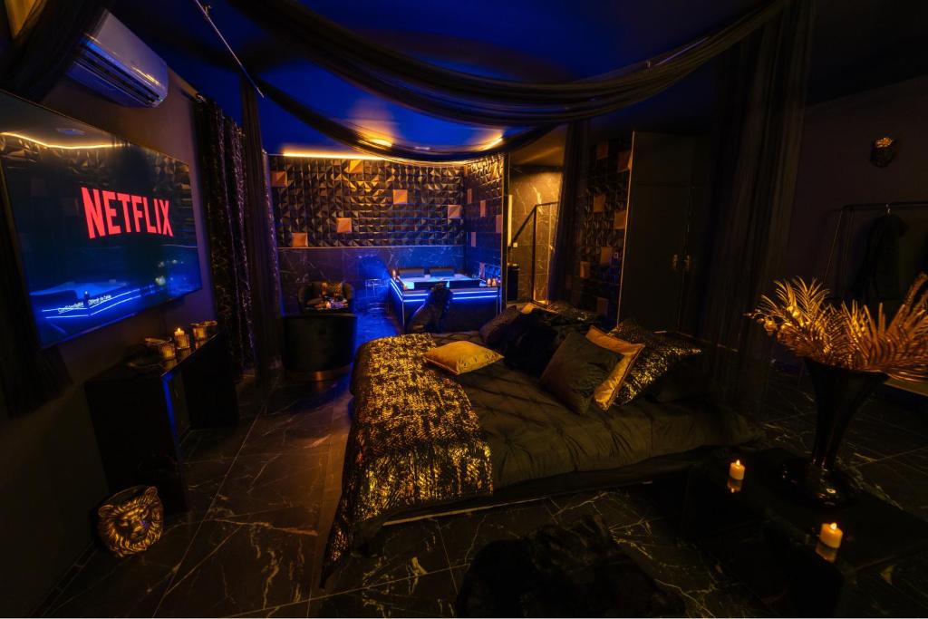 a room with a couch and a room with blue lights at MaLoveRoom in Bevons