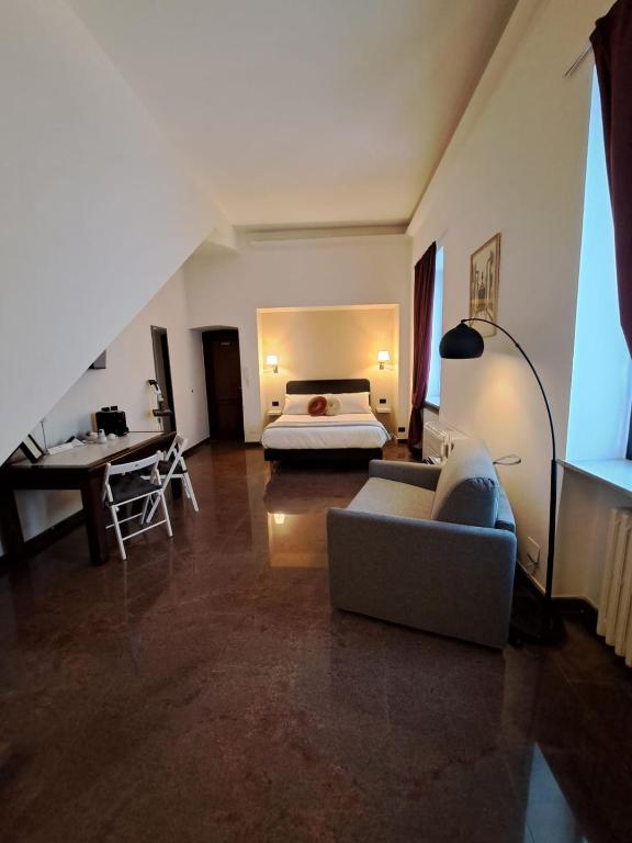 Postel nebo postele na pokoji v ubytování Palazzo Cusani Charming Rooms