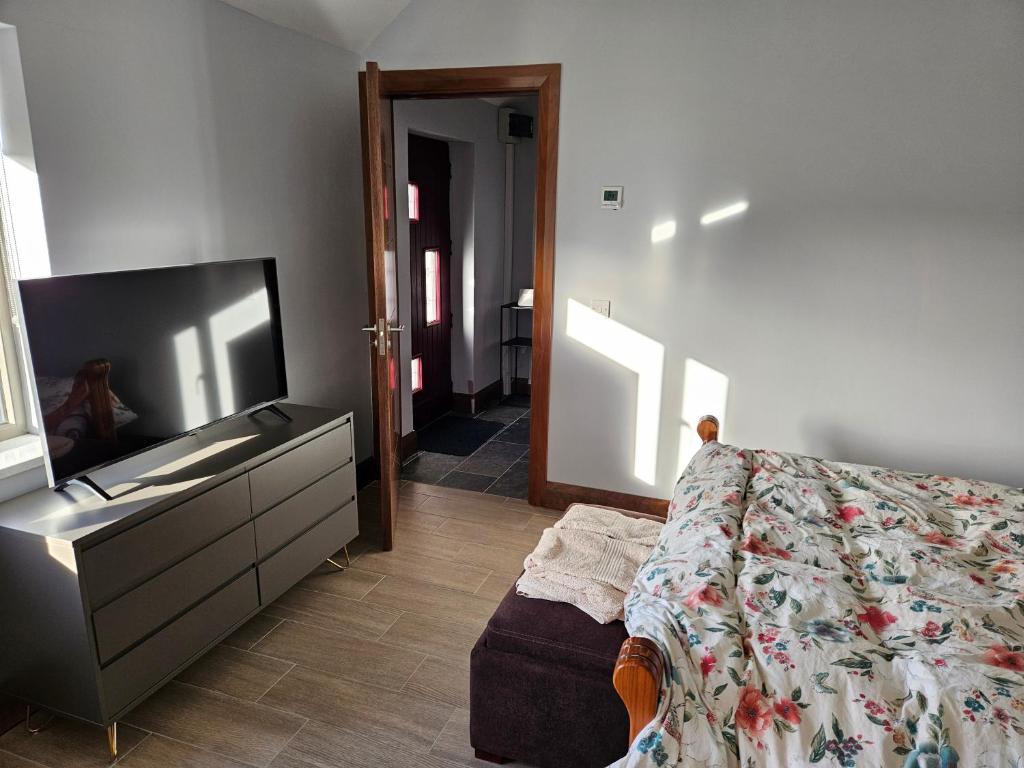 Postel nebo postele na pokoji v ubytování Suaimhneas