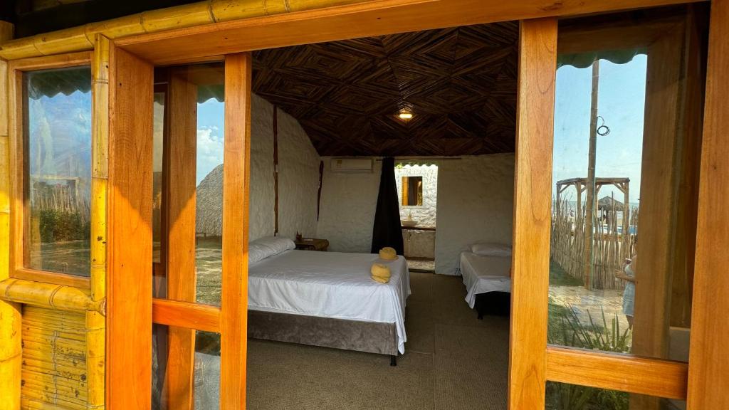 Postel nebo postele na pokoji v ubytování Guajira Beach