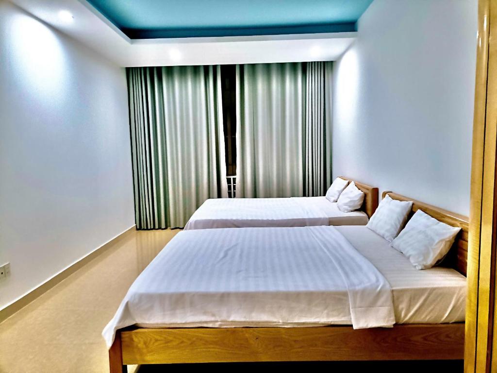 Ένα ή περισσότερα κρεβάτια σε δωμάτιο στο Homestay View Biển Vũng Tàu