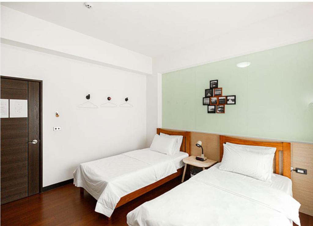 Postel nebo postele na pokoji v ubytování Chenting Yiyu B&B