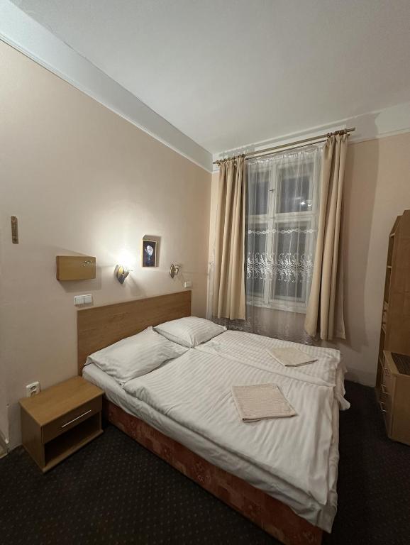 Postel nebo postele na pokoji v ubytování Penzion Dubík