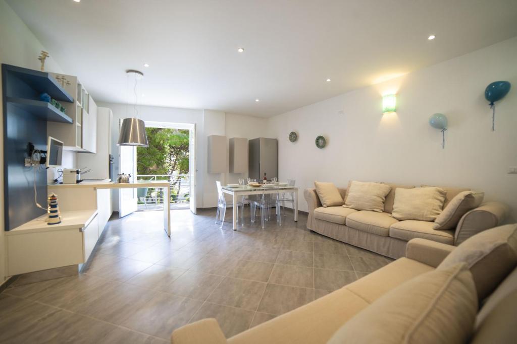 a living room with a couch and a table at MARIMAR - Apartments OTRANTO in Otranto