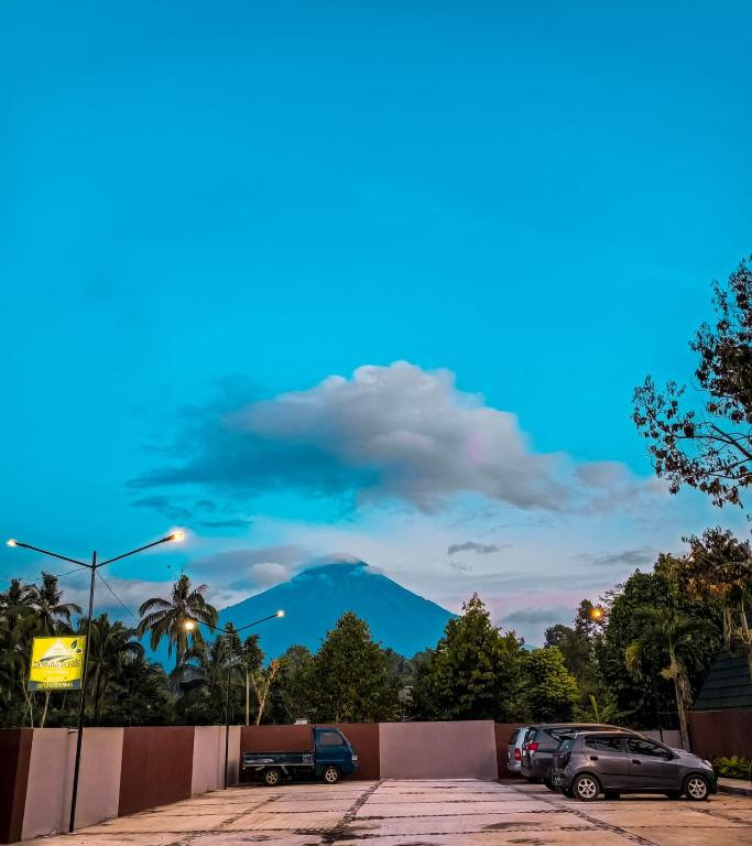a view of a mountain from a parking lot at Kaliningrat Cottage 2 in Pronojiwo