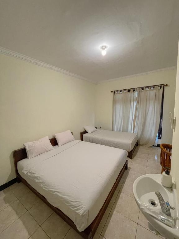 Postel nebo postele na pokoji v ubytování dAlvin Multiple Stays