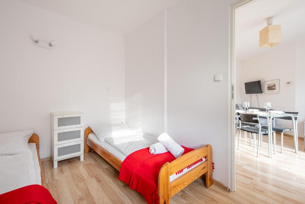 Posteľ alebo postele v izbe v ubytovaní Apartamenty Smrekowa Zakopane