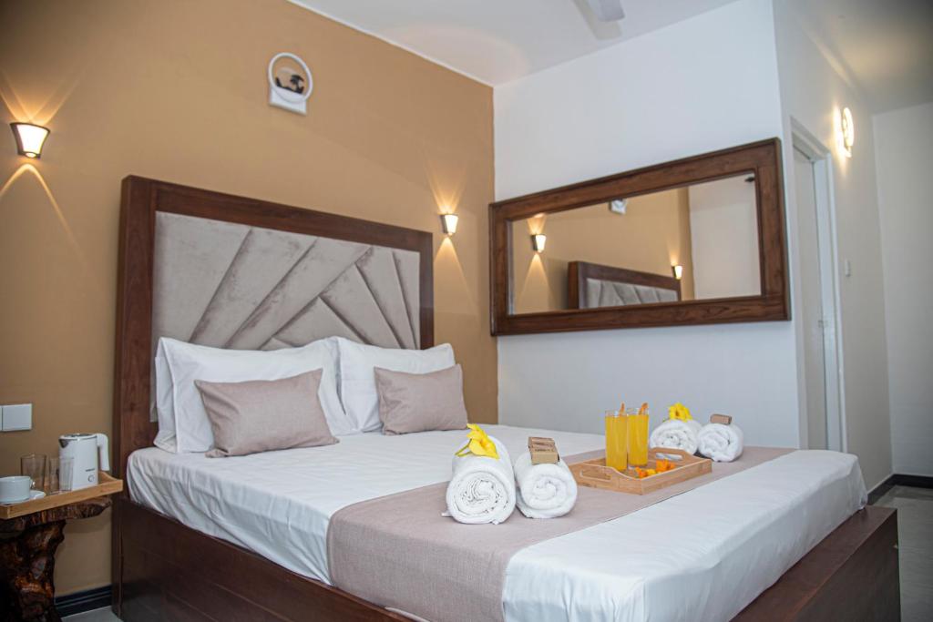 Postel nebo postele na pokoji v ubytování Sky Garden Hotel - KANDY