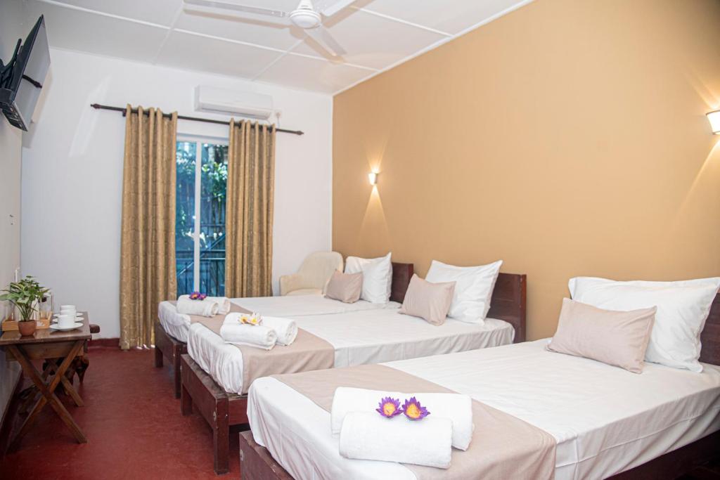 Postel nebo postele na pokoji v ubytování Sky Garden Hotel - KANDY