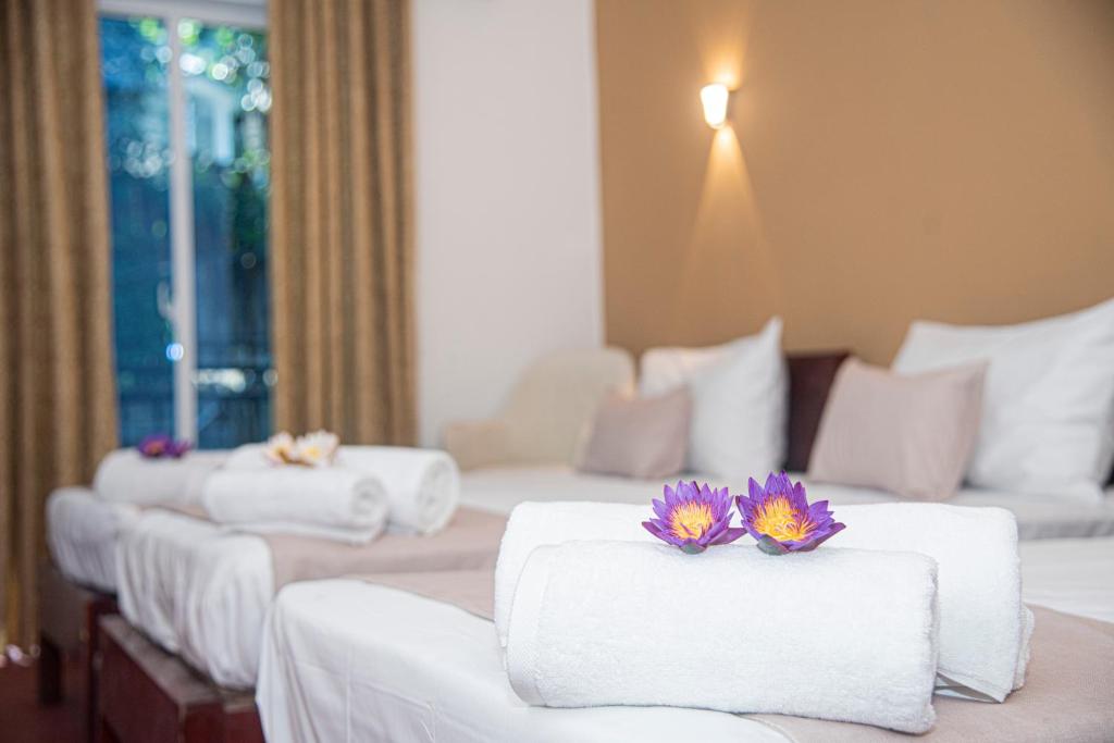 Postel nebo postele na pokoji v ubytování Sky Garden Hotel - KANDY