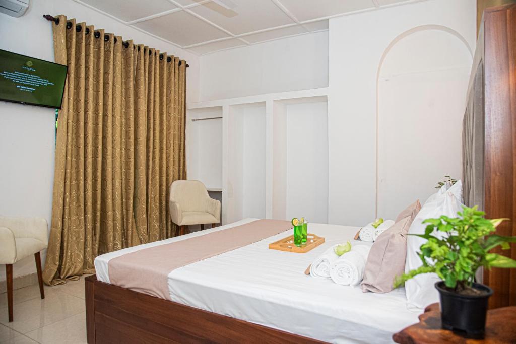 Postel nebo postele na pokoji v ubytování Sky Garden Hotel - KANDY