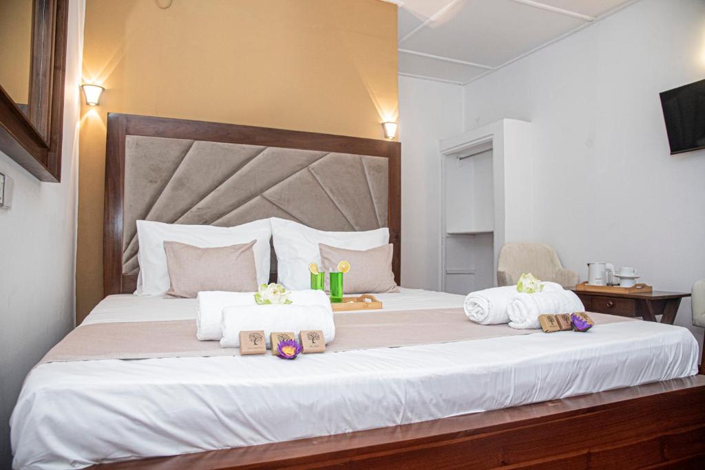 Postel nebo postele na pokoji v ubytování Sky Garden Hotel - KANDY