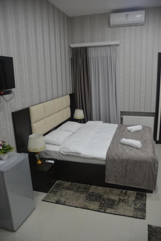Postel nebo postele na pokoji v ubytování Hotel Care Inn