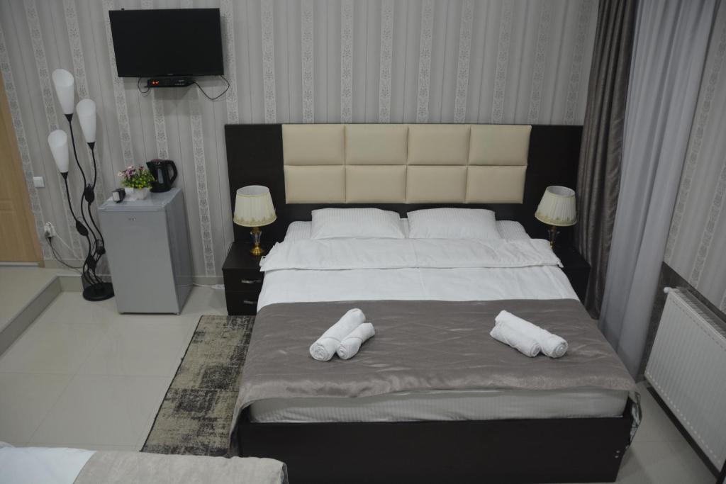 Postel nebo postele na pokoji v ubytování Hotel Care Inn