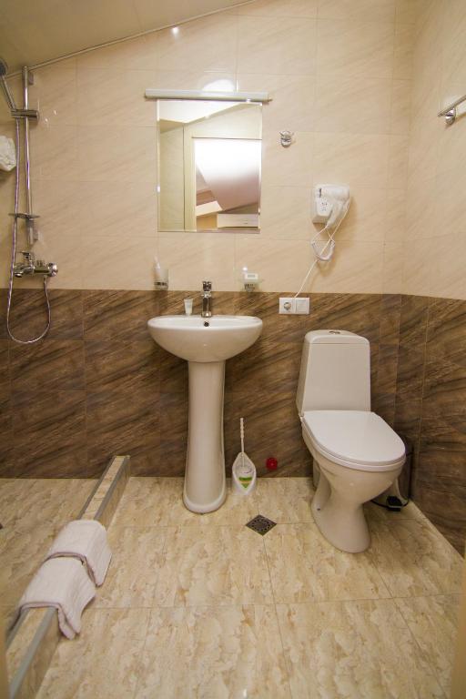 Koupelna v ubytování Hotel Care Inn