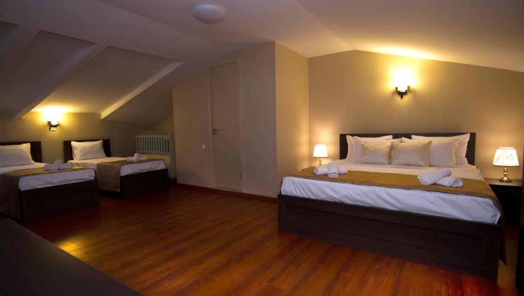 Postel nebo postele na pokoji v ubytování Hotel Care Inn