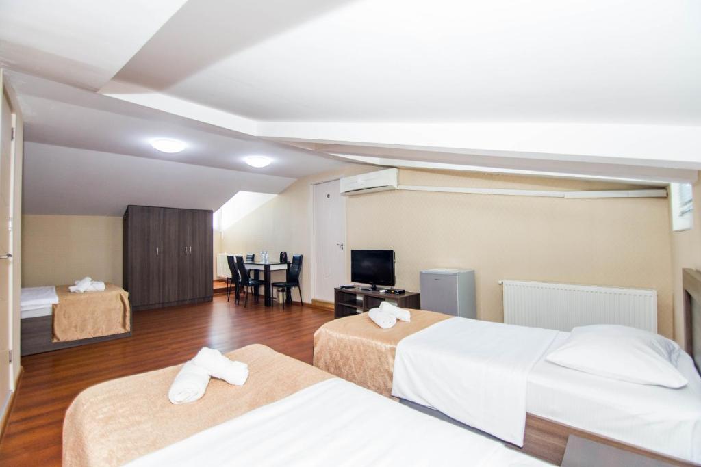 Postel nebo postele na pokoji v ubytování Hotel Care Inn