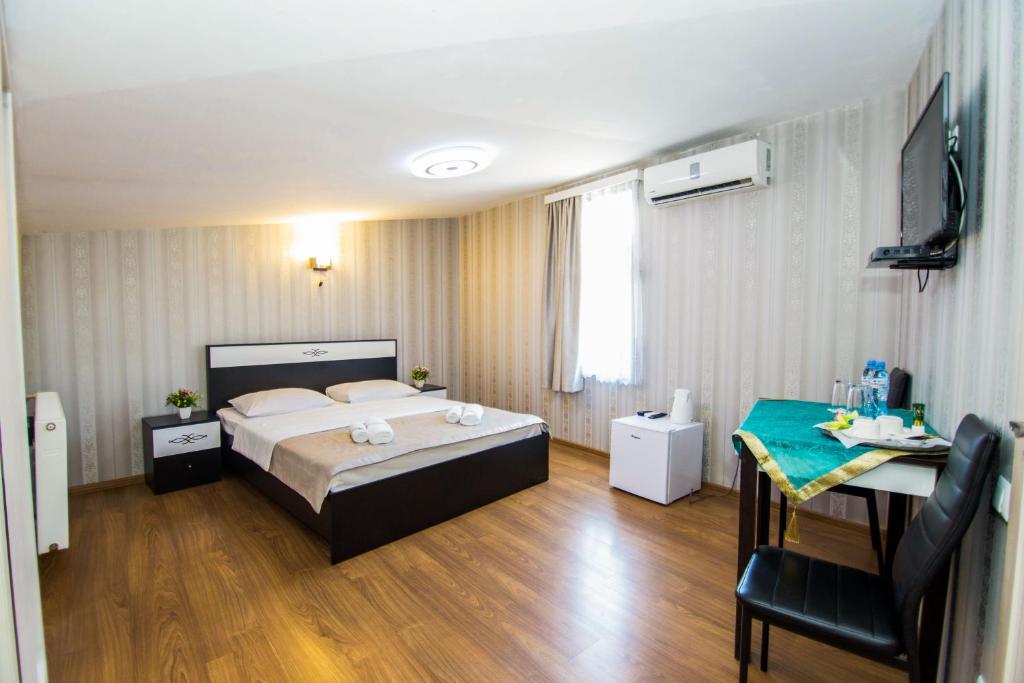 Postel nebo postele na pokoji v ubytování Hotel Care Inn