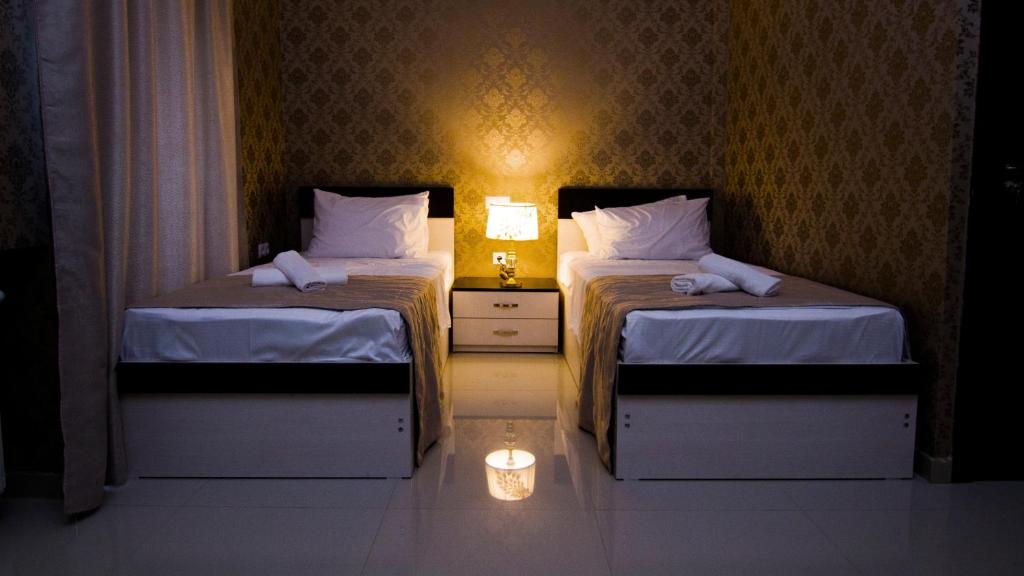 Postel nebo postele na pokoji v ubytování Hotel Care Inn